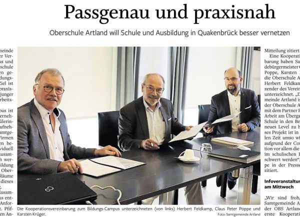 Ausschnitt aus dem Zeitungsartikel mit dem Bild der drei Vertretern der Kooperation